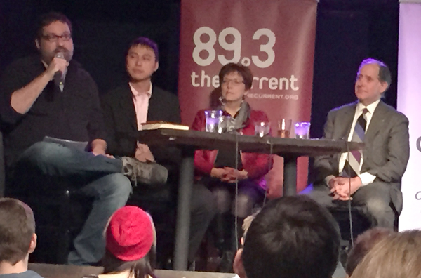 Photo of Commissioner Zelle and discussion panel at Policy and a Pint event.