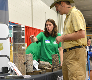 Photo of Sarah Jarman working at the MnDOT State Fair booth.