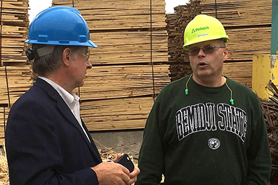 Commissioner Charlie Zelle and potlatch worker.