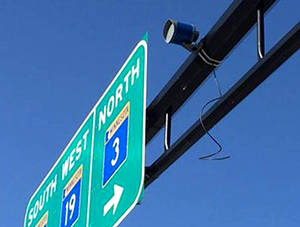 Photo of a bicycle sensor on a stop light.