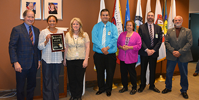 Photo of Charlie Zelle, Kim Collins. Cindy Bellefeuille, Craig Hansen, Patti Petite, Don Carlson and Ed Fairbanks.