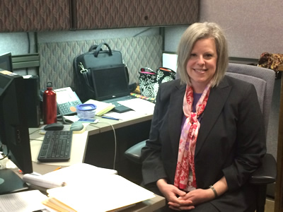 Deanna Belden sitting at desk