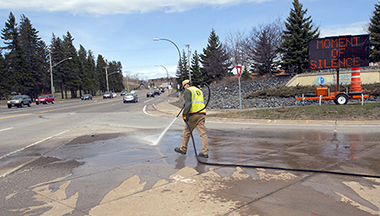 Photo of Jason McPherson power washing median.