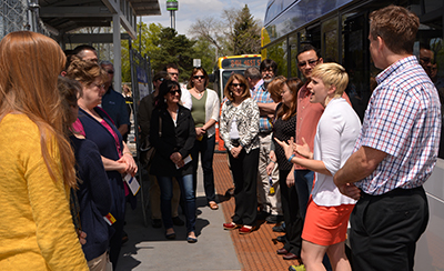 Photo of Katie Roth and employees at Metro Transit A line.