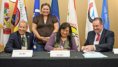 Photo of leaders signing Memorandum of Understand.