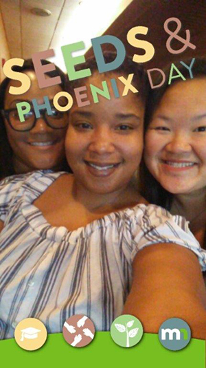 3 women take a selfie at Seeds and Phoenix Day to promote using a GeoFilter