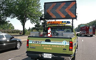 FIRST truck with flashing arrows.