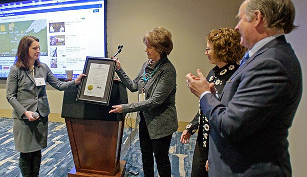 Photo of Joanna Dornfeld, Linda Aitken, Roxanne Richards and Commissioner Charlie Zelle.