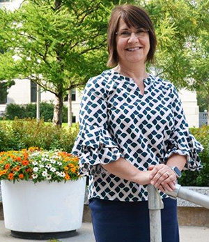 Judy Schmidt, standing outside