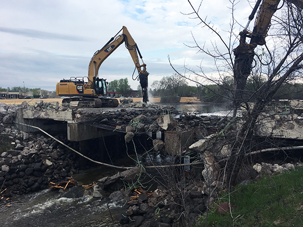 Machine demolishes bridge