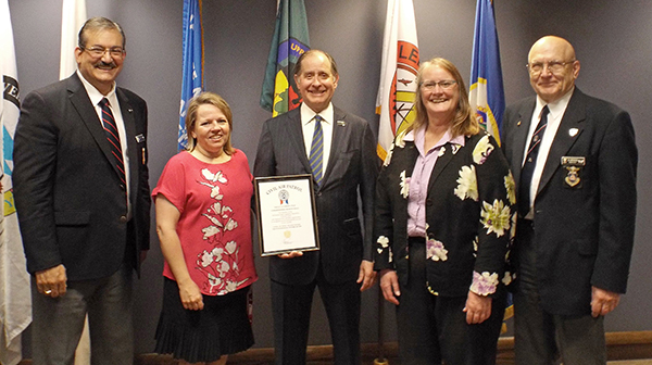 Photo of James Garlough, Cassandra Isackson, Commissioner Charlie Zelle, Kathy Vesley and Col. Kevin Sliwinski.