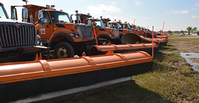 Photo of snowplows lined up for SPOT training.