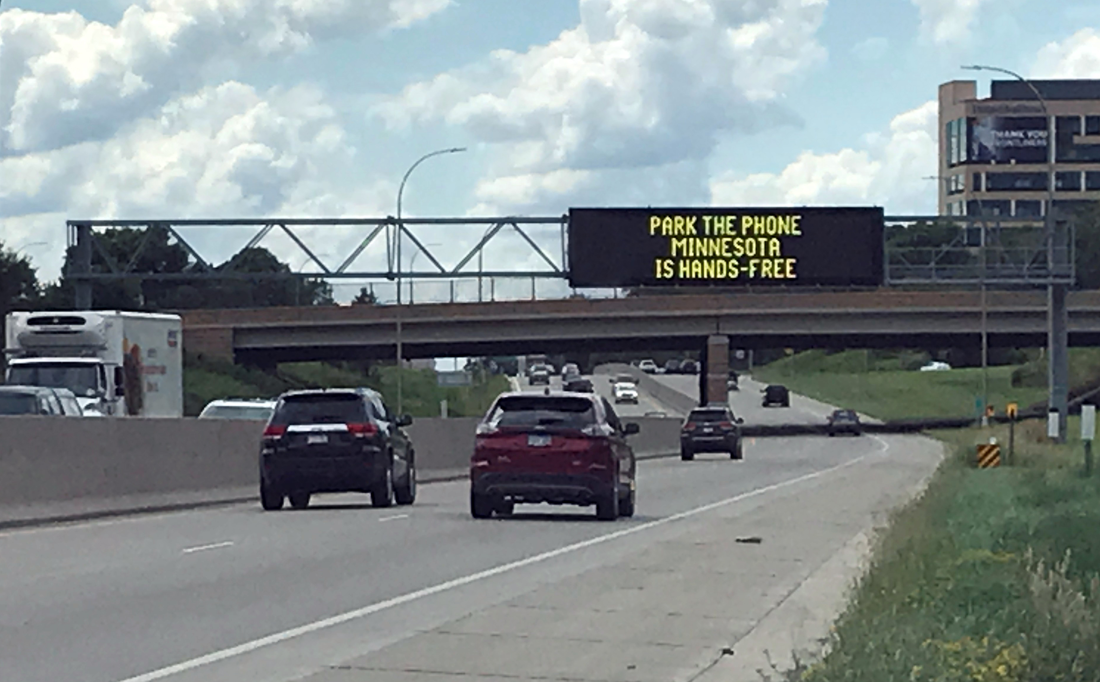 Photo: electronic road sign over a highway.