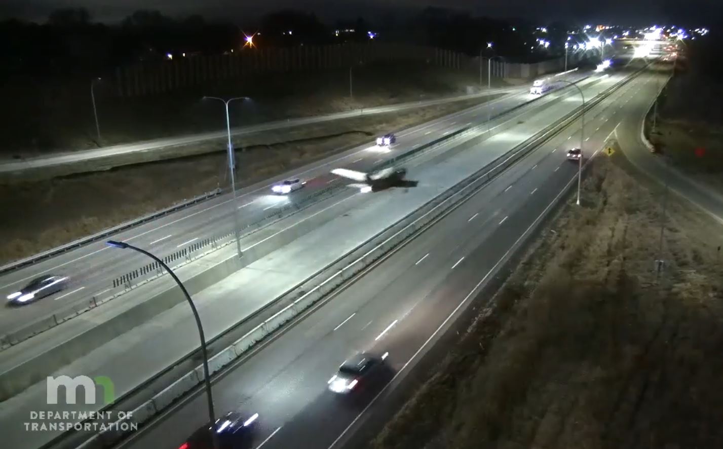 Photo: a small plane about to land on a highway