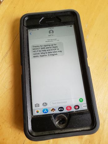 Photo: a cellphone with an alert on the screen