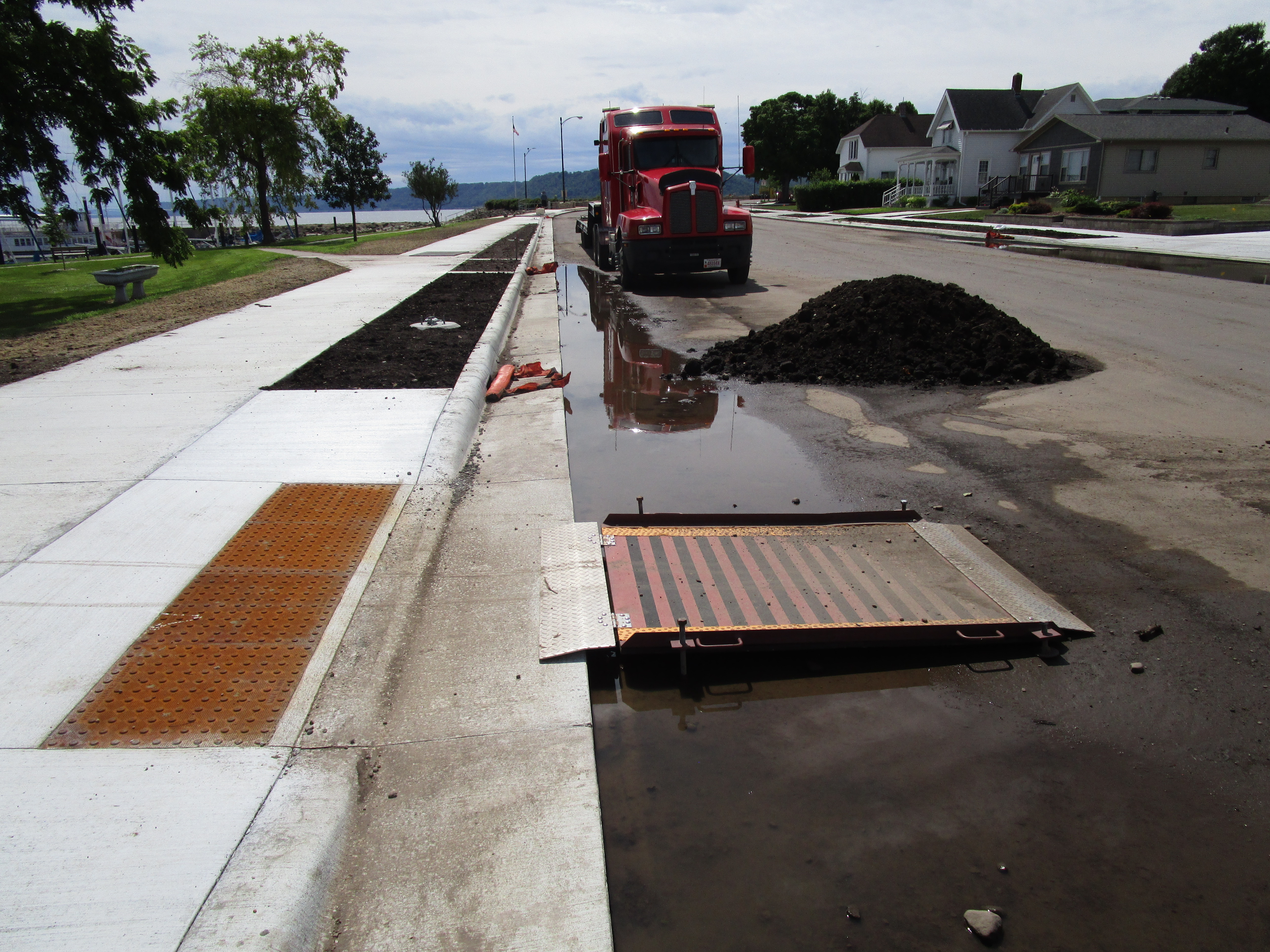 Photo: a temporary ramp bridging a sideway to a road