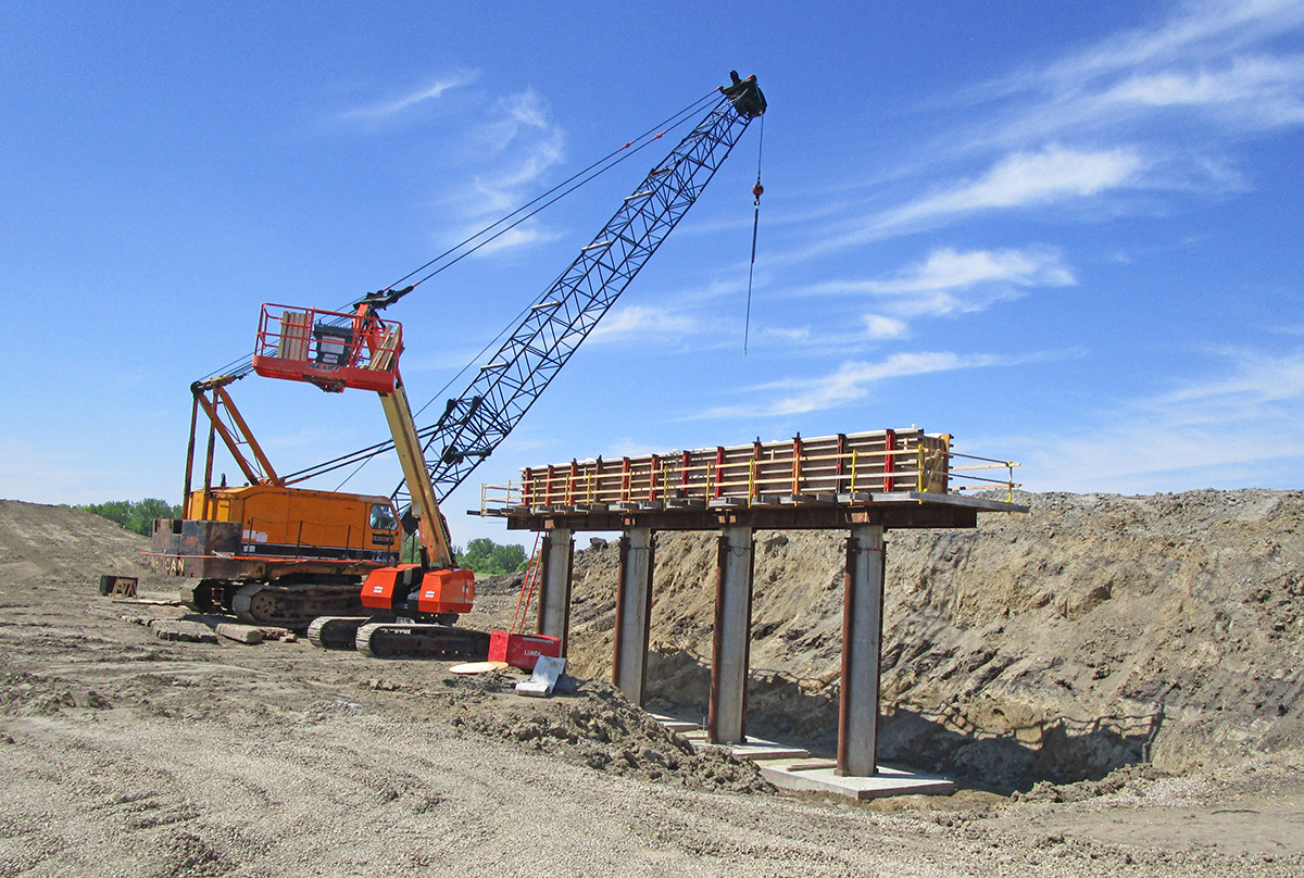 Photo: a crane position near some bridge piers