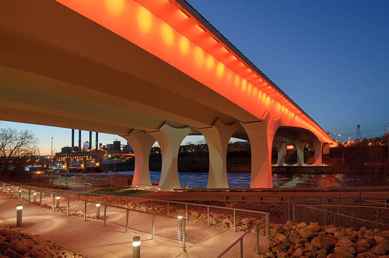 Photo: bridge illuminated in red