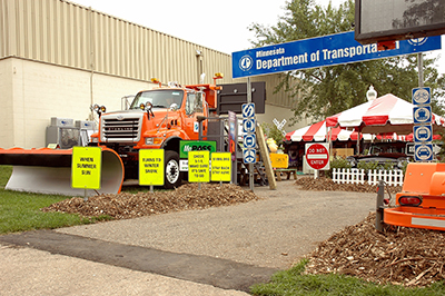 Photo: a plow outside of MnDOT's State Fair booth in 2006