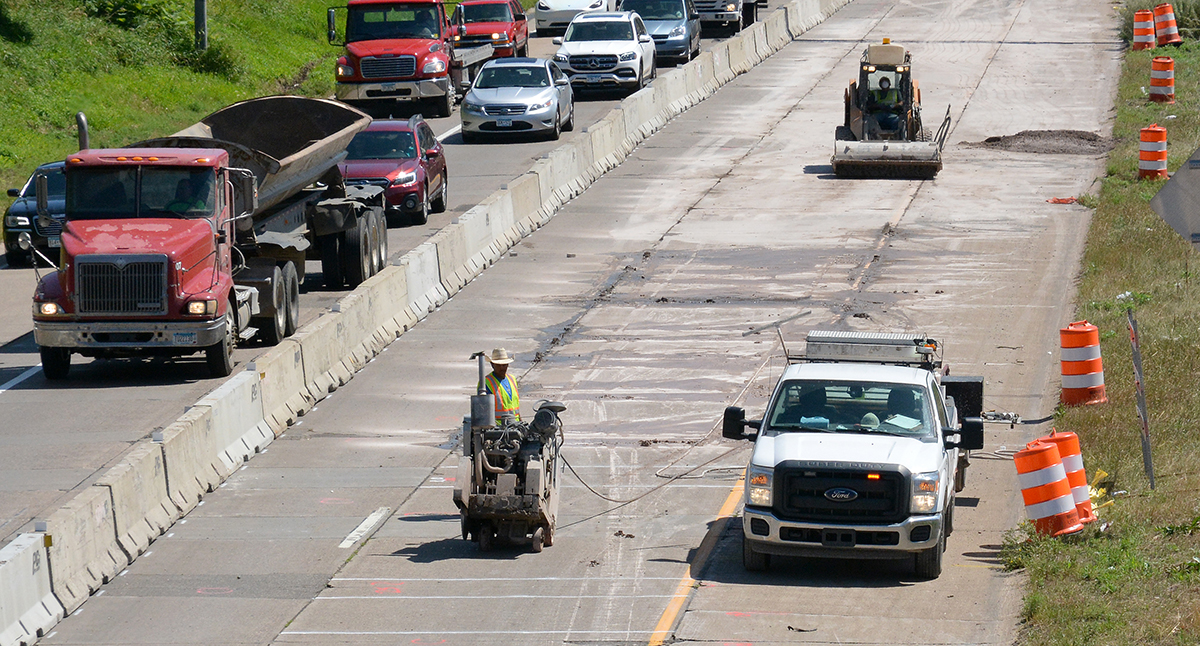 Photo: crews at work, with the St. Paul skyline in the background