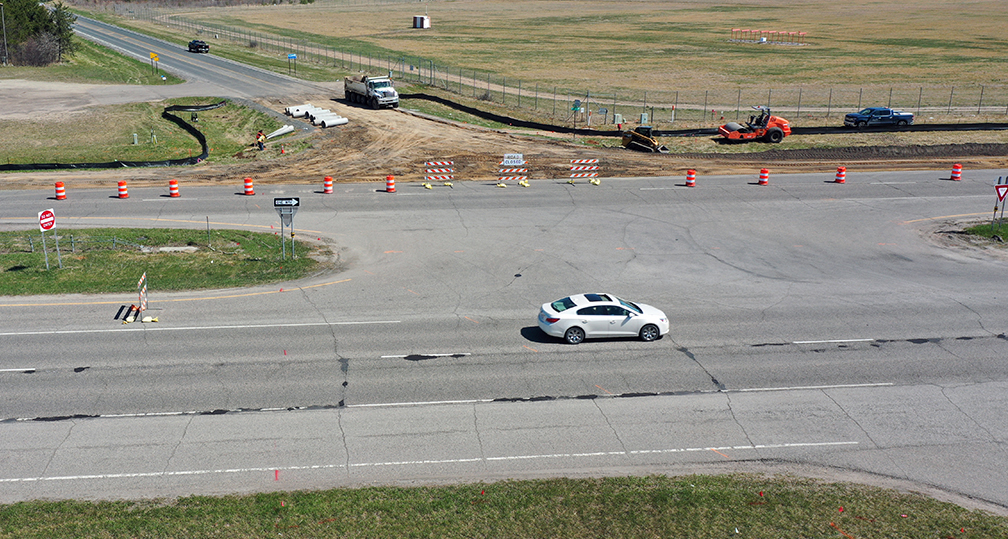 Photo: construction signage by a intersection under construction