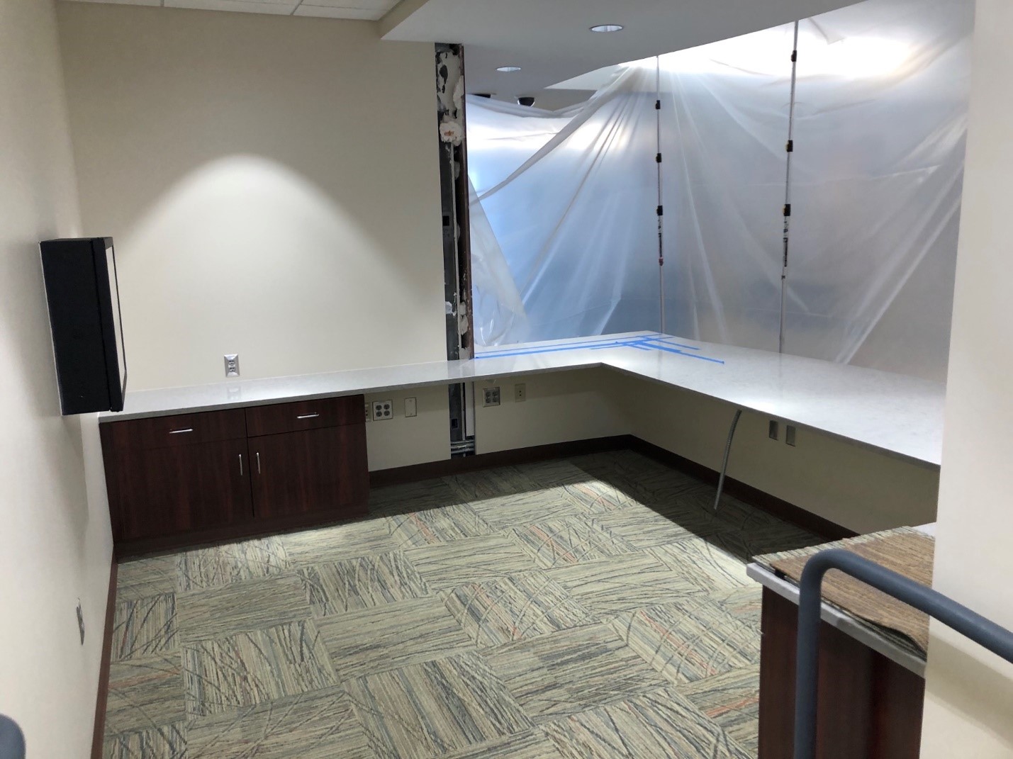 Photo: a desk station under construction at Central Office