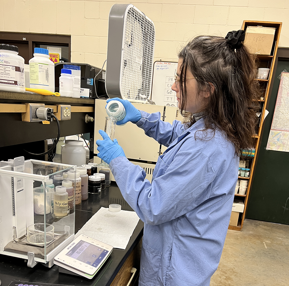 Photo: Kaelyn Stahovich near lab equipment