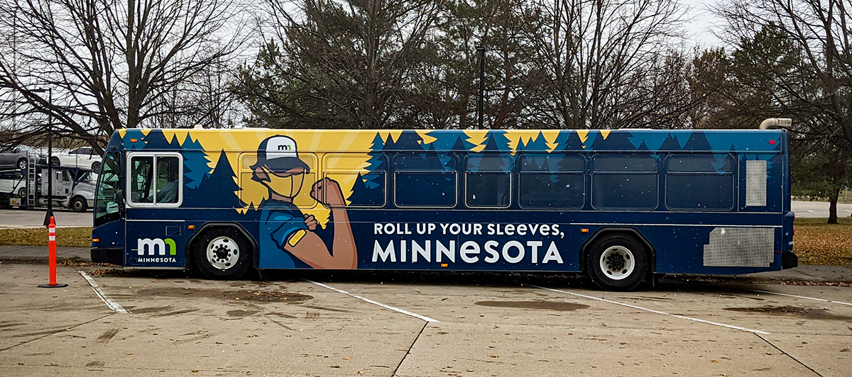 Photo: a bus with Roll up Your Sleeves Minnesota graphics