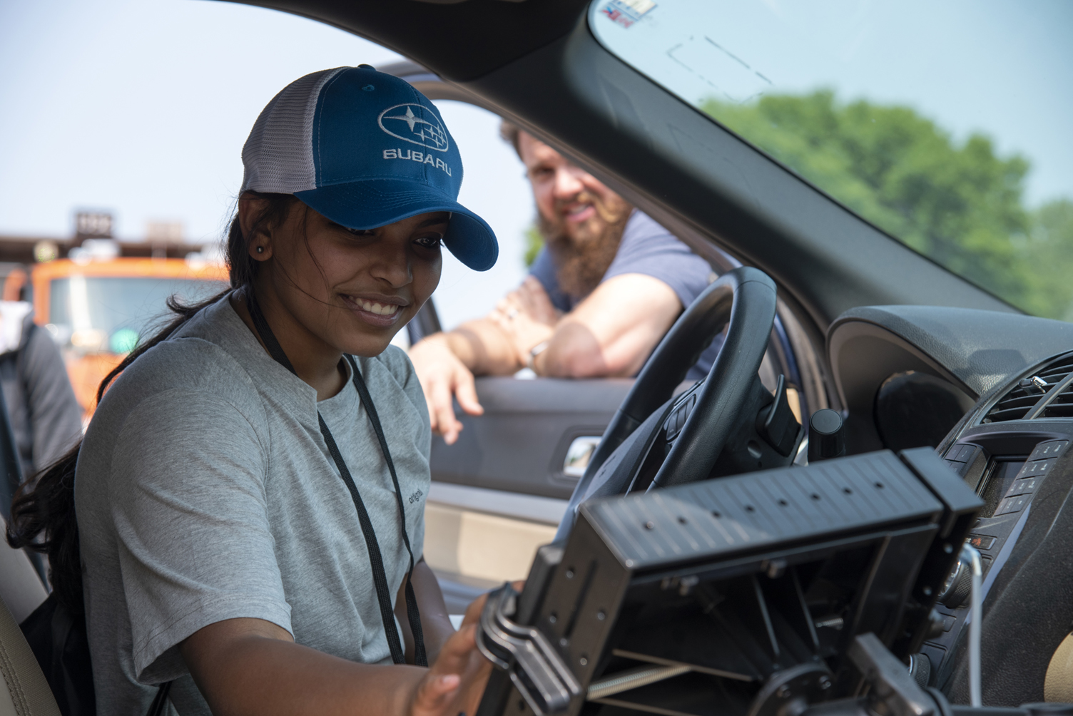 Photo: a student behind the wheel of a vehicle