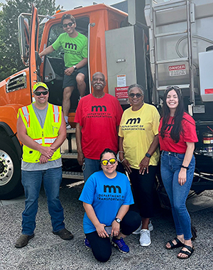 Photo: Eight staff members who represented MnDOT at the annual International Festival.