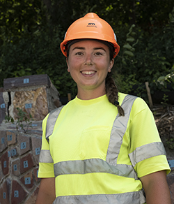 Bailey Wolff wearing reflective gear and orange hard hat