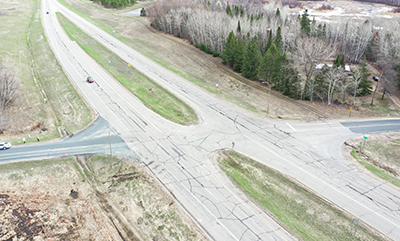 Graphic: Researchers checkout vegatation along a road.