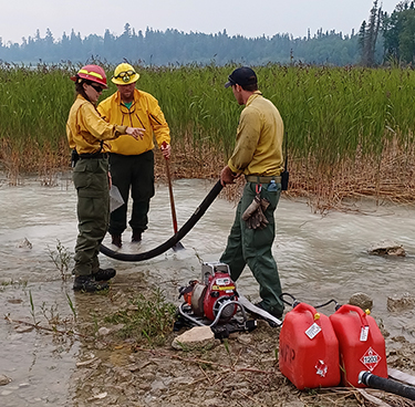 Photo of Anthony Murilla working with fire crew.