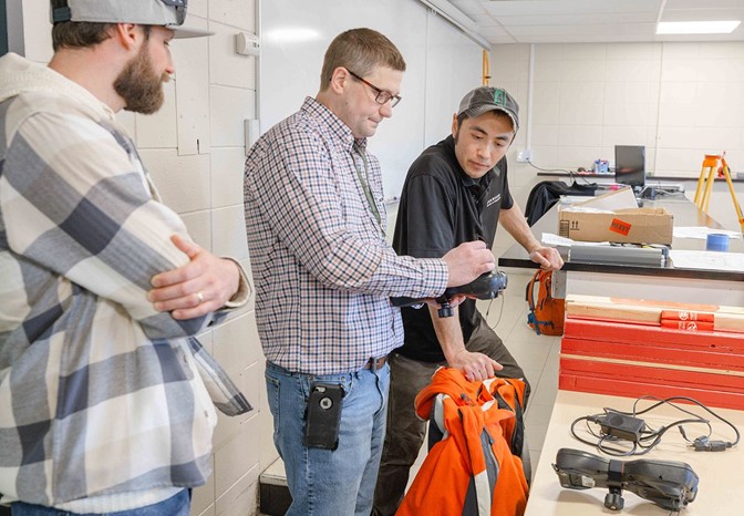 Photo: MnDOT staff looking at equipment