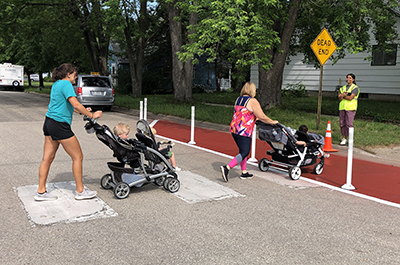 Photo: Pedestrians crossing the road.