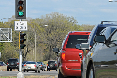 Photo of traffic at a highway ramp meter.