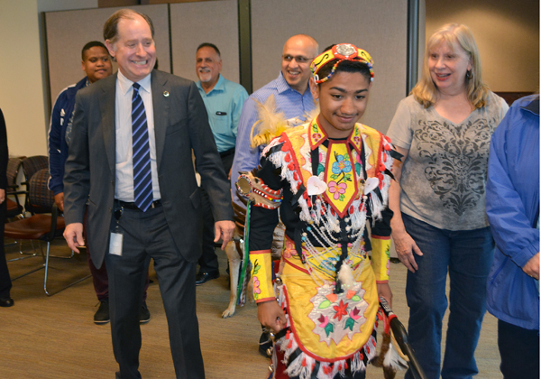 Photo of Commissioner Zelle and MnDOT staff doing round dance.