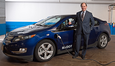 Photo of Commissioner Charlie Zelle by MnDOT car.