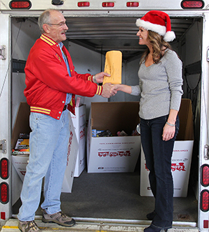 Photo of Sarah Dragt and Toys for Tots representative.