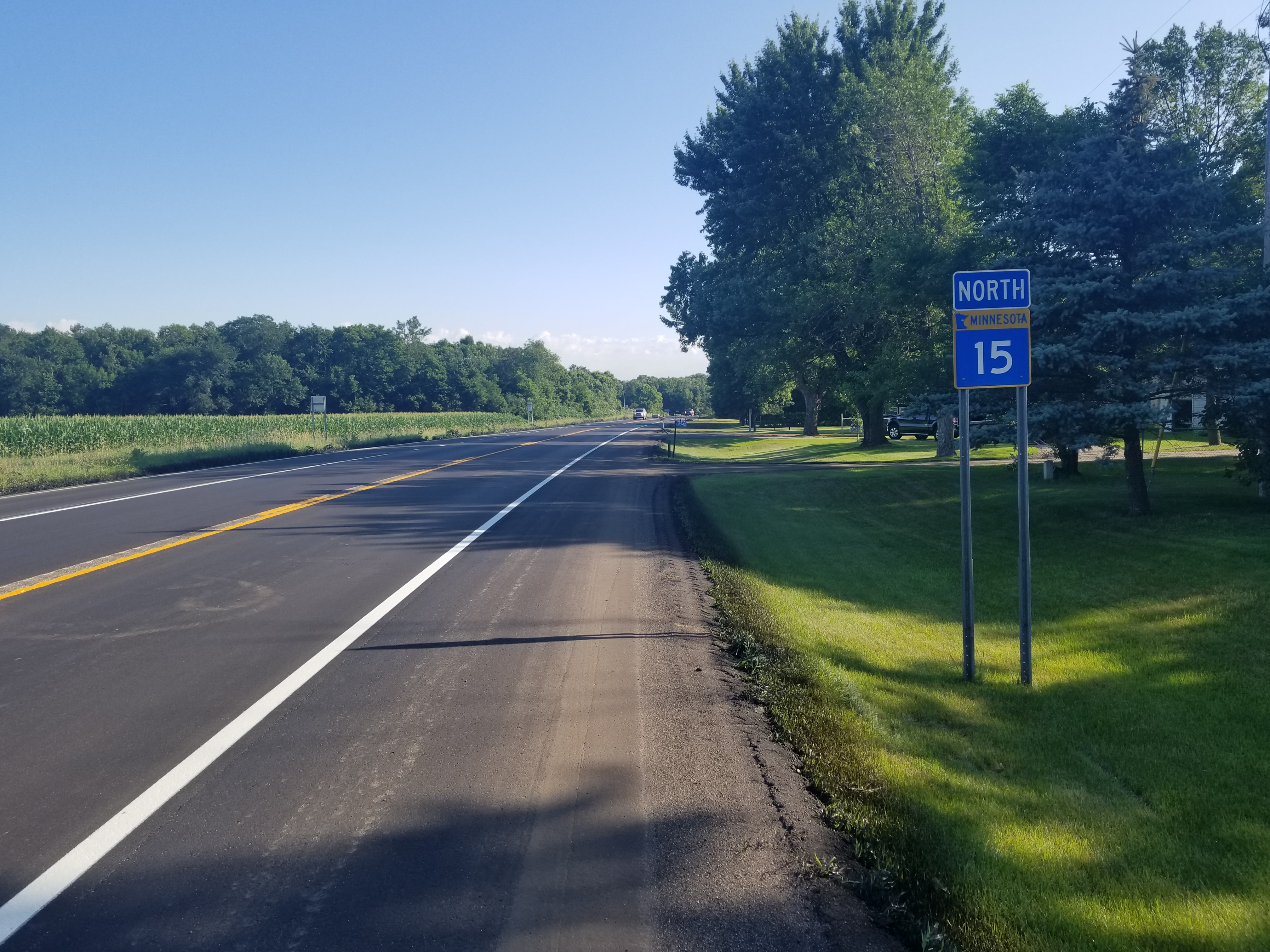 A finished stretch of highway, marked with a sign reading North 15