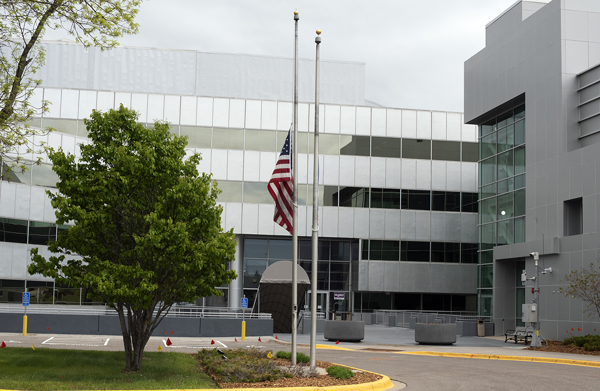 Photo: the flag outside of the Water's Edge building at half-staff.