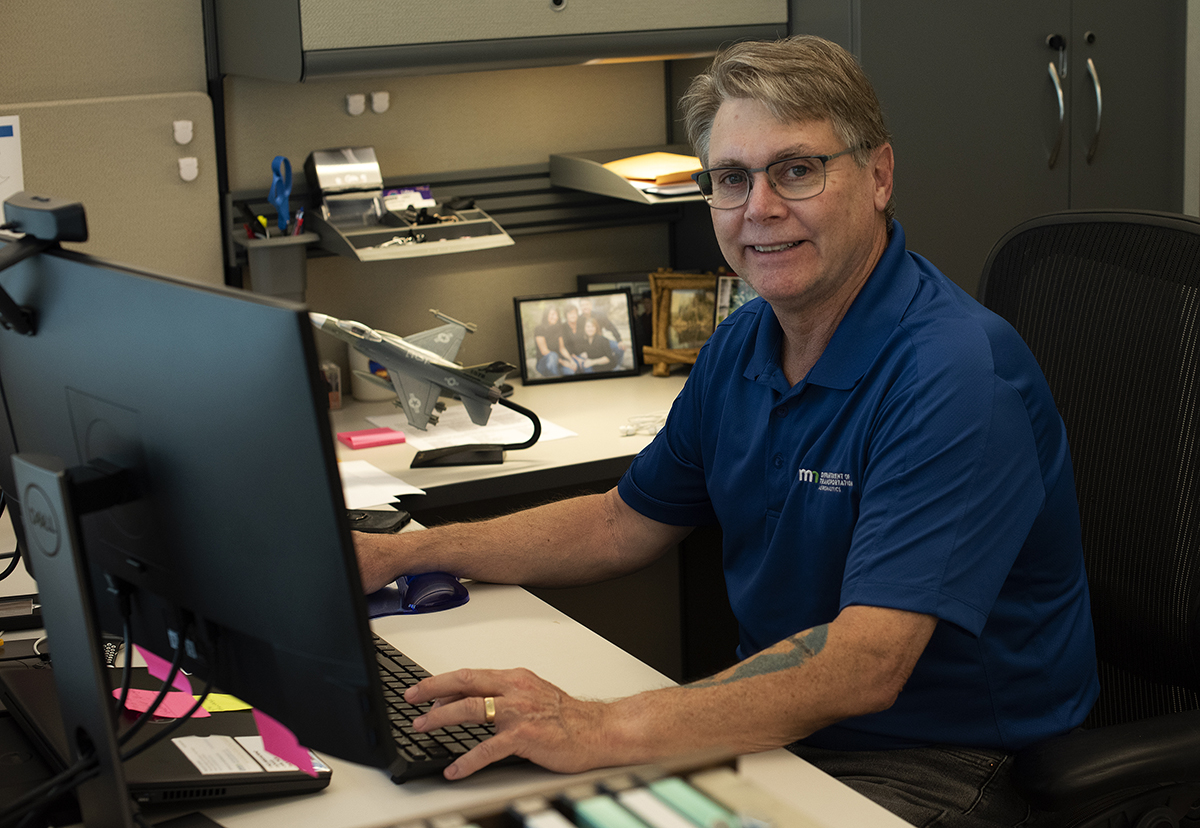 Photo: man sitting as a desk