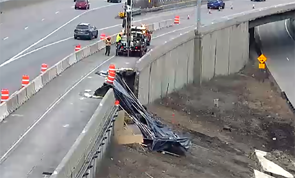 Photo: Two concrete retaining wall panels along Interstate 35W that fractured.